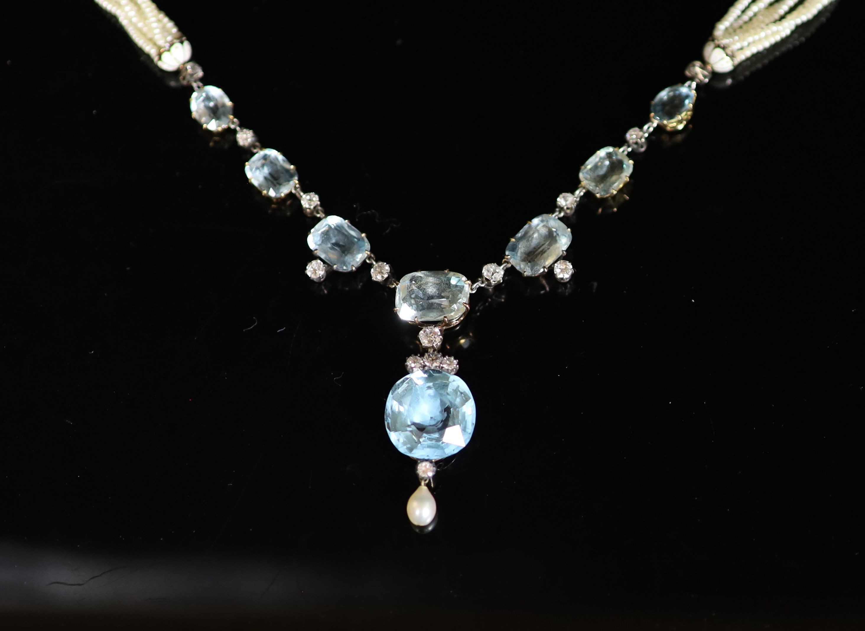 A 19th century gold and silver, aquamarine, diamond, pearl and enamel set multi strand seed pearl drop necklace